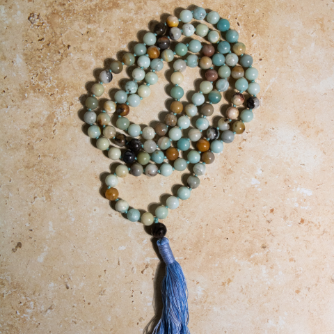 Amazonite is a beautiful and varied stone with an array of aqua green stones associated with the throat chakra. Extremely soothing stone. Calms the brain and nervous system and aligns the physical body. The Amazonite Mala helps with calm and intention during meditation and prayer.
